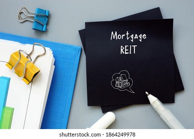 Financial Concept About Mortgage REIT With Sign On The Piece Of Paper..