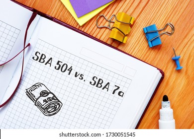 Financial Concept About SBA 504 Vs SBA 7a With Sign On The Piece Of Paper.