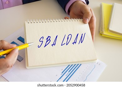 Financial Concept About SBA LOAN Small Business Administration With Sign On The Writing-pad. 
