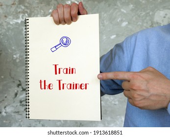 Financial Concept About Train The Trainer With Phrase On The Piece Of Paper.
