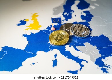 Financial concept with golden Bitcoin, Litecoin and Ethereum over and EU map