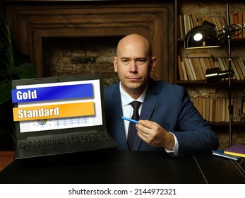 Financial Concept Meaning Gold Standard With Sign On Laptop.
