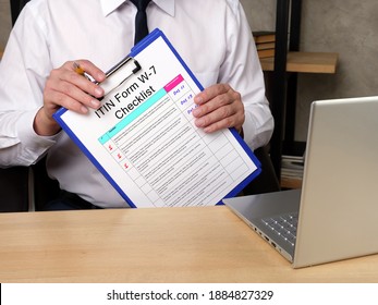  Financial concept meaning Individual Taxpayer Identification Number ITIN Form W-7 Checklist with phrase on the sheet. - Shutterstock ID 1884827329