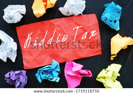 Financial concept meaning Kiddie Tax with sign on the piece of paper.