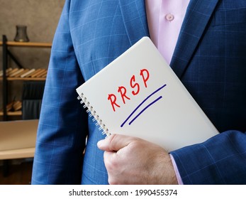 Financial Concept Meaning RRSP Registered Retirement Savings Plan With Inscription On The Piece Of Paper. 
