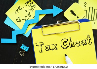 Financial Concept Meaning Tax Cheat With Sign On The Piece Of Paper.