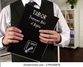 Financial concept meaning Taxpayer Bill Of Rights -TABOR with inscription on the piece of paper. - Shutterstock ID 1799240878