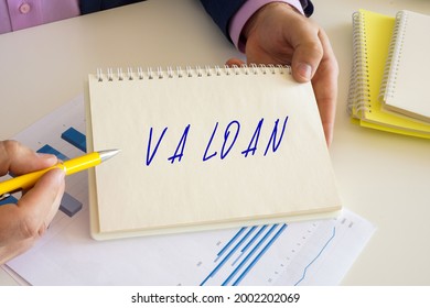 Financial Concept Meaning VA LOAN Veterans Affairs home Loan With Sign On The Writing-pad. 
