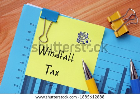 Financial concept meaning Windfall Tax with sign on the sheet.
