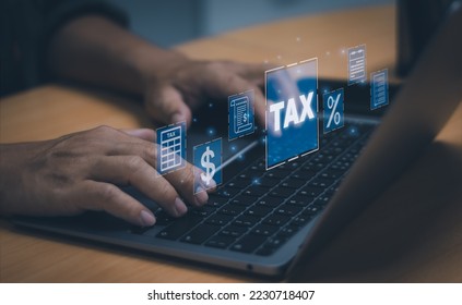 Financial concept or online taxes filing, man typing with laptop computer show income and expenses to fill out a personal income tax payment form. - Shutterstock ID 2230718407