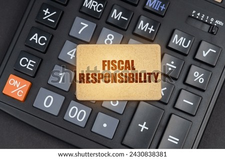 Financial concept. There is a sign on the calculator that says - Fiscal responsibility