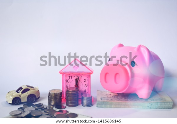 Financial\
concepts, car models, saving money, coins and Czech paper money\
separately on a white background -\
image