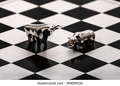 Financial Confrontation Between A Silver Bull And A Bear On A Chessboard