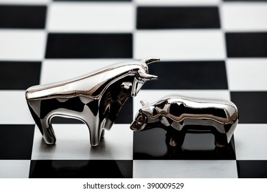 Financial Confrontation Between A Silver Bull And A Bear On A Chessboard