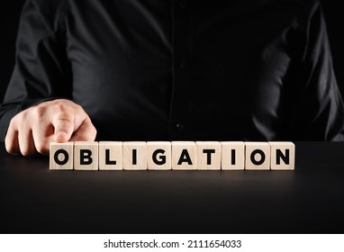 Financial, corporate or legal obligations concept. Male hand presses the wooden cubes with the word obligation. - Shutterstock ID 2111654033