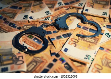 Financial Crime Concept - Handcuffs On Cash Money