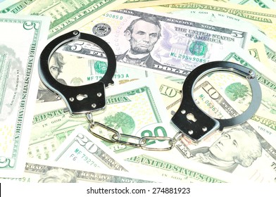 Financial Crime Concept With Handcuffs On Money Background