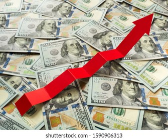 Financial crisis inflation growth concept. Red arrow up chart on a background of dollars