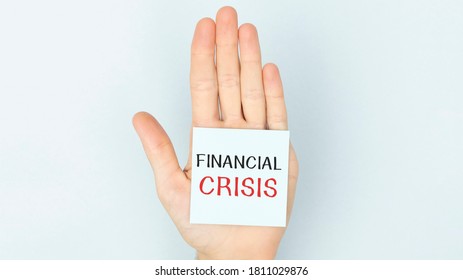 Financial Crisis Word Written On A Piece Of Paper.