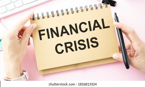 Financial Crisis Word Written On A Piece Of Paper.