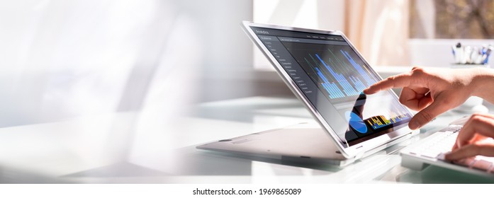 Financial Data Analyst Female Using KPI Dashboard On Laptop - Powered by Shutterstock