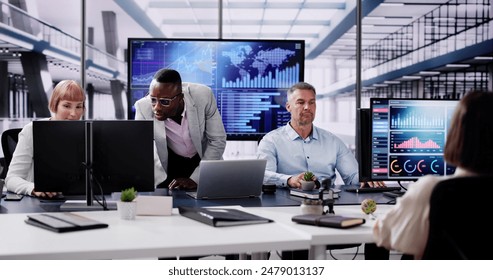 Financial Data Analysts Using Performance Dashboard On Screens In Office