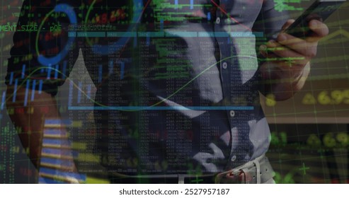 Financial data processing against mid section of a man using smartphone. Global finance and business technology concept