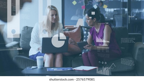 Financial data processing image over businesswomen discussing work in modern office. finance, teamwork, technology, collaboration, corporate, strategy