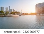 financial district buildings of shanghai and and Huangpu river in sunny day, and the yacht docked at the dock