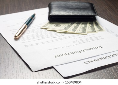 Financial document with wallet, money and fountain pen - Shutterstock ID 158489804