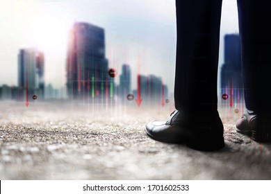 Financial Or Economy Crisis Concept. Vision Of Business Leader. Stock Marketing Graph Is Going Crash And Down. Low Section Of Businessman Standing To Looking At The Urban City