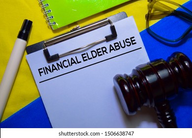 Financial Elder Abuse Text On Document Form And Gavel Isolated On Office Desk.
