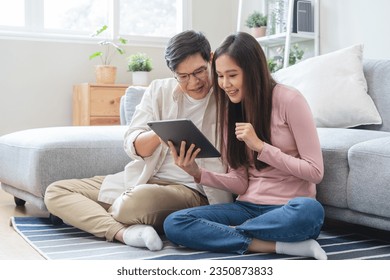 financial in family concept, Happy Asian husband and wife calculating income and bills to plan for investment. - Powered by Shutterstock