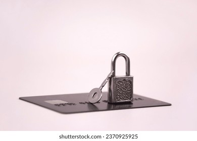 Financial fraud protection concept: credit card, padlock and master key on the light background. - Powered by Shutterstock