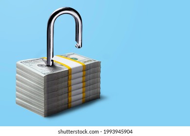 Financial freedom concept. Padlock on stacks of 100 US Dollar bill, Ideas for Debt-free, Unlocking business financial, Liquidity, Business loan, Saving and investing money, Security deposit, Start-up - Shutterstock ID 1993945904