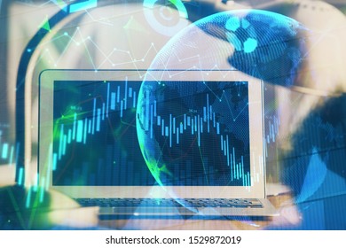 Financial graph colorful drawing and table with computer on background. Multi exposure. Concept of international markets. - Shutterstock ID 1529872019