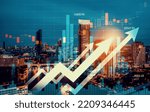 Financial graphs and digital indicators overlap with modernistic urban area, skyscrabber for stock market business concept. Double exposure.
