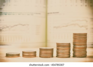 Financial growth concept with stacks of coins in yellow color and vintage filter background