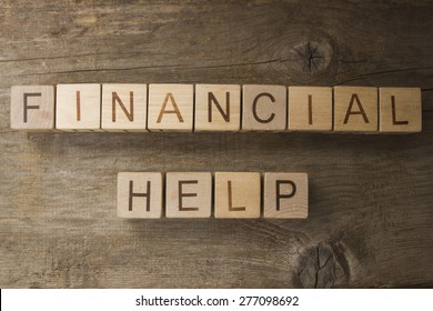 Financial help text on a wooden background
