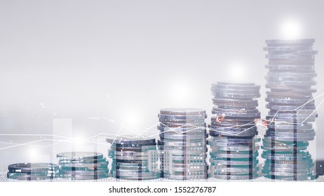 Financial investment concept, Double exposure of city night and stack of coins for finance investor, Forex trading candlestick chart economic , ECN Digital economy, business, money, passive income.