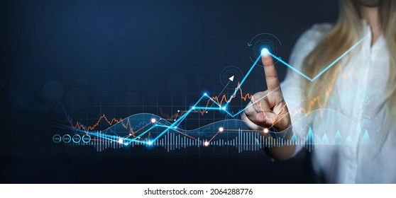 Financial and investment data concept. Business woman draws sales data, progress of business and growth graph plan. Business strategy and corporate development.  - Shutterstock ID 2064288776