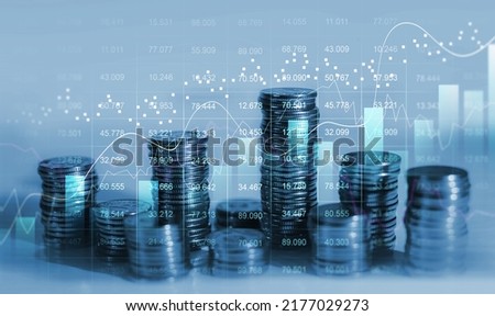 Financial investment and  success market stock technology currency report. Stacks of  coin with trading graph.Business financial chart graph on economy.