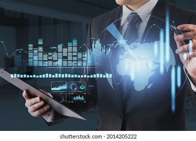 Financial line graph showing increase of price in stock market, internet trading concept, globe hologram. A trader highlighting the point of growth. Forex. Businessman in formal suit.