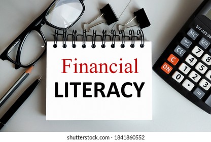 Financial Literacy, Text On White Paper On Gray Background