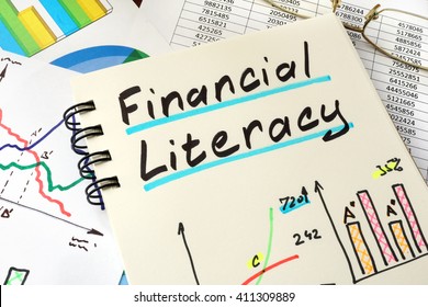 Financial Literacy Written On A Notepad Sheet. Education Concept.