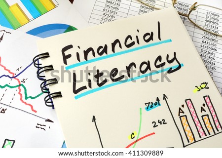 Financial Literacy written on a notepad sheet. Education concept.