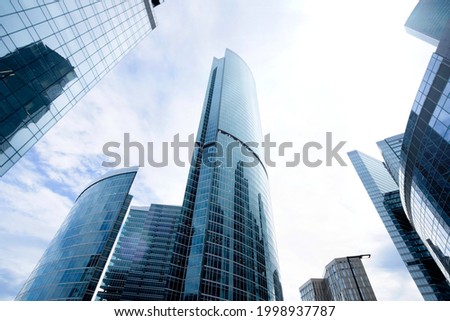 financial office building looking up,modern skyscrapers,glass tower buildings in business district on sky background, architecture