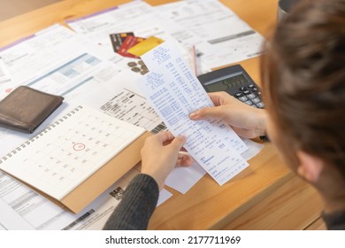 Financial owe asian woman, female sitting on floor home, stressed and confused by calculate expense from invoice or bill, have no money to pay, mortgage or loan. Debt, bankruptcy or bankrupt concept. - Shutterstock ID 2177711969