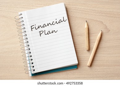 financial plan on notebook on desk