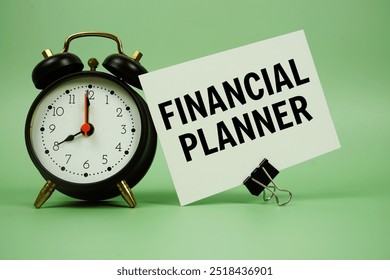 Financial Planner text message on paper card with alarm clock on green background - Powered by Shutterstock